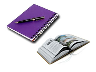 Libro abierto junto a bloc de notas y bol�grafo